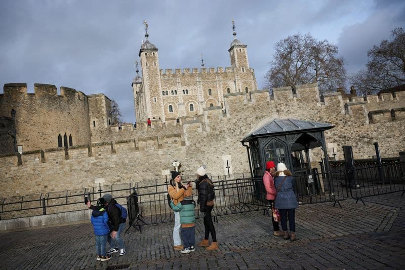 Four arrested at Tower of London after apple crumble and custard thrown at State Crown display