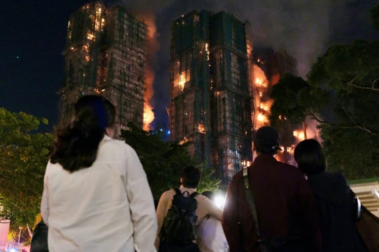 ‘Very worried’: Hong Kong fire survivors hunt for the missing